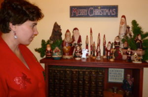 Lindsey Looking at Christmas Figurines