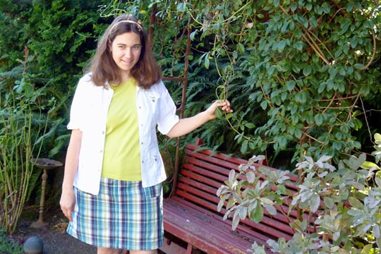 Lindsey Atwell Standing In Front of Red Bench